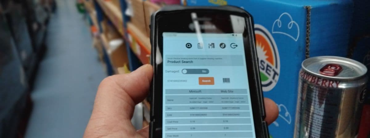 Handheld scanner being used for stock booking in a Best Before It's Gone warehouse